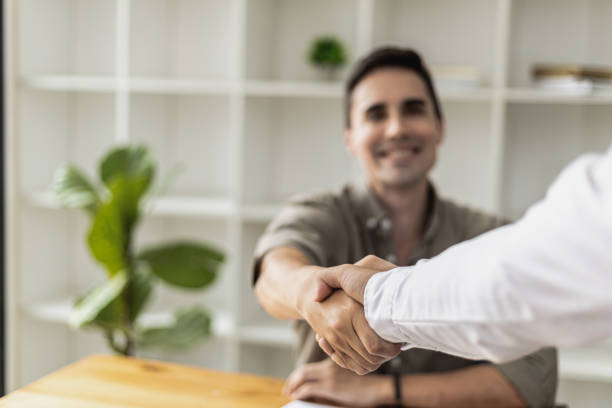 istock A young businessman is shaking hands with a business partner after a discussion. Two businessmen shaking hands. A handshake is a gesture of respect or congratulation. Business etiquette concept. 1341139256