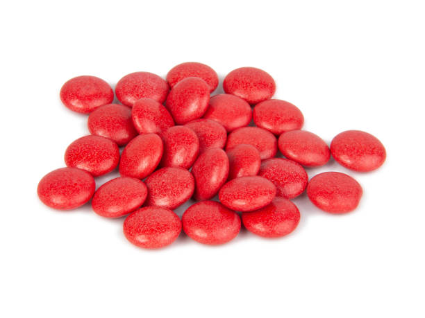 istock Red dragee chocolate glazed isolated on the white background 1341140652