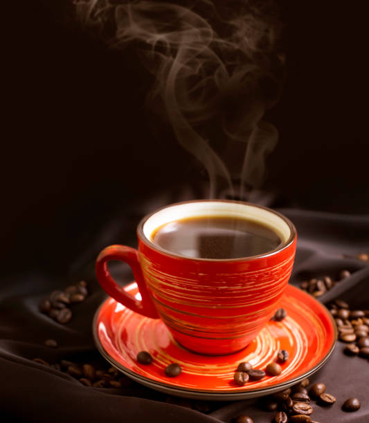 istock cup of coffee, grain on silk background 1341141656