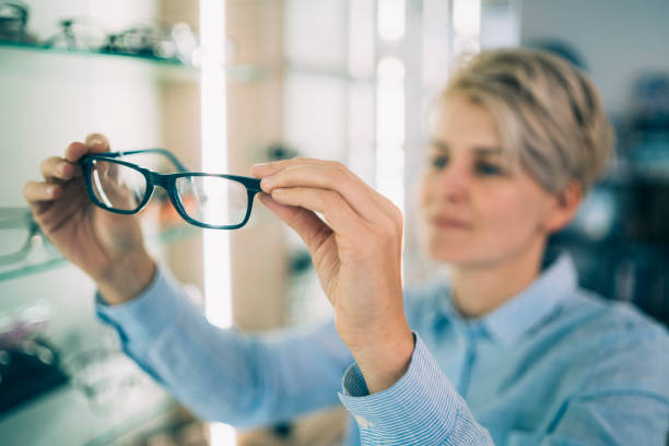 istock Woman admiring her new glasses 1341145345