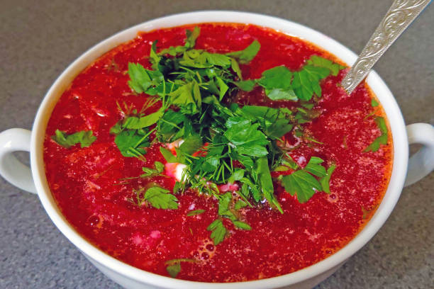 Red hot delicious borscht with herbs. Out of focus. Red hot delicious borscht with herbs, food. Out of focus common beet audio stock pictures, royalty-free photos & images