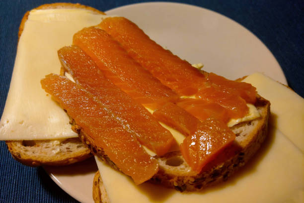 istock Delicious sandwich with butter, cheese and smoked fish. 1341148086