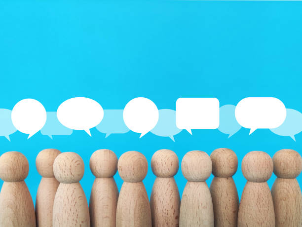 istock Wooden people figures with speech bubbles above their heads. Brainstorming, discuss and comment in community concept 1341148204