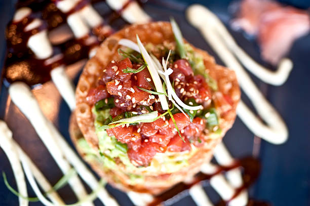Raw diced Ahi Tuna and guacamole  tostadas close up picture (a fusion of japanese and mexican cuisines)