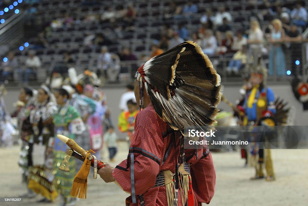 american indian chief from behind american indian in his traditional dress from behind in a pow wow Pow-wow Stock Photo