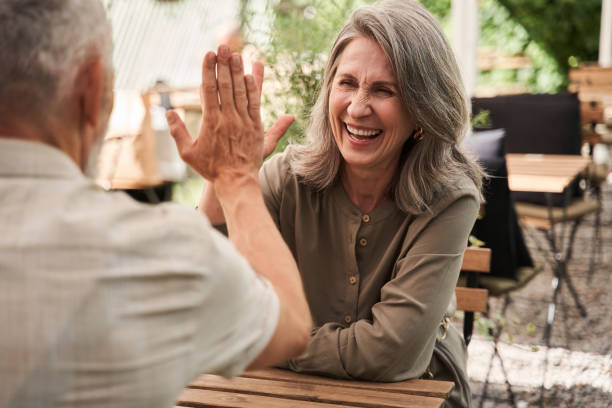 istock Senior woman giving five to her beloved husband while discussing something 1341157144