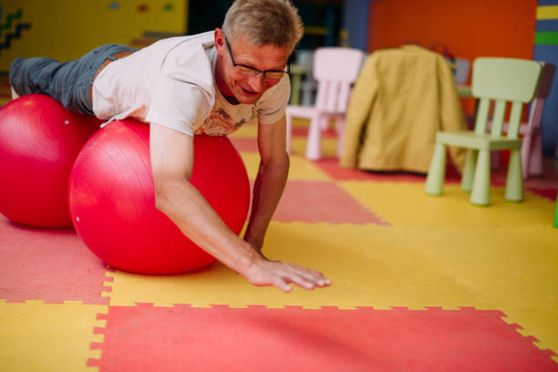istock grandfather older man having fun with a ball 1341159789