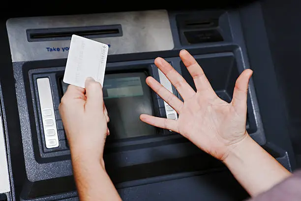 Photo of Whatever the ATM says, she isn't happy!