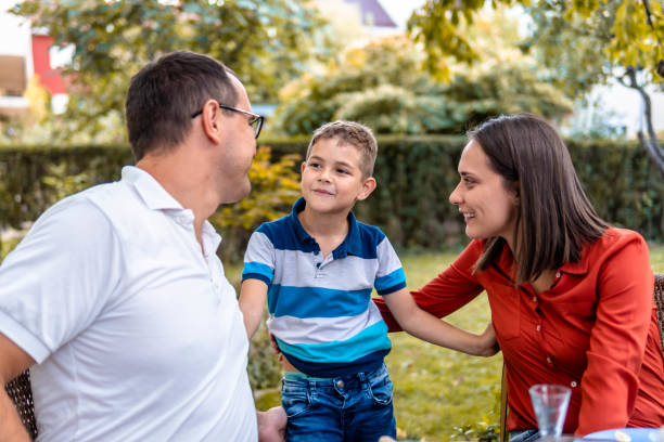 istock Happy family spending their weekend day in the front yard 1341160658