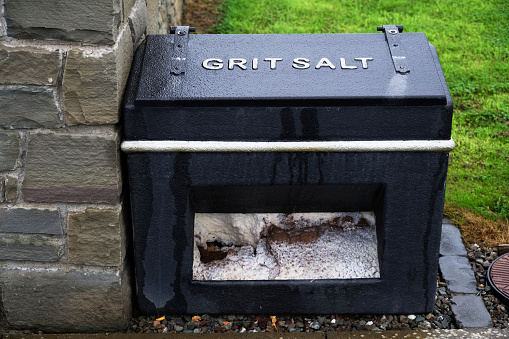 Salt grit black container for winter road safety on council road uk