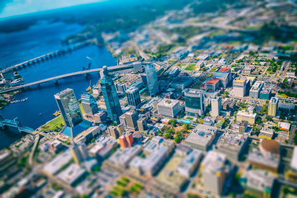 Jacksonville Florida Aerial Abstract Aerial view of the beautiful skyline of Jacksonville Florida along the St. Johns River from an altitude of about 1000 feet over the city processed in tilt-shift for an abstract feel. tilt shift stock pictures, royalty-free photos & images