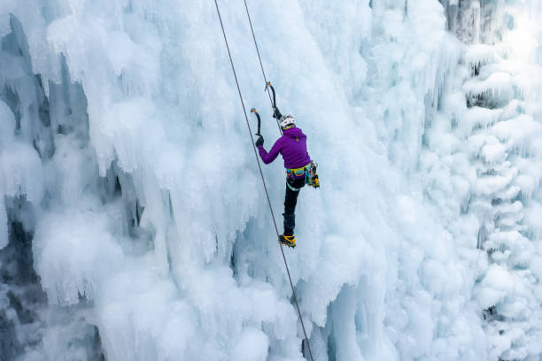 istock Woman climbing an icy slope 1341170314