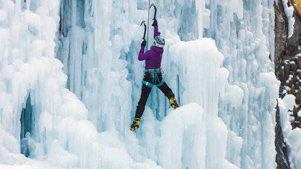 istock Climber with ice climbing equipment 1341170417