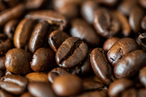 Roasted sumatran coffee beans filling the frame in macro