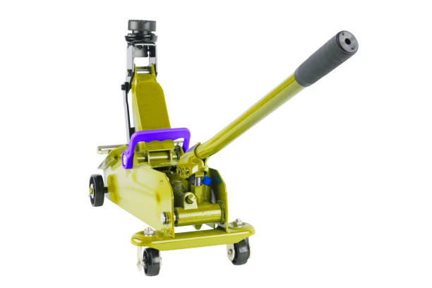 istock yellow hydraulic car jack isolated on white background, lifted up 1341171211