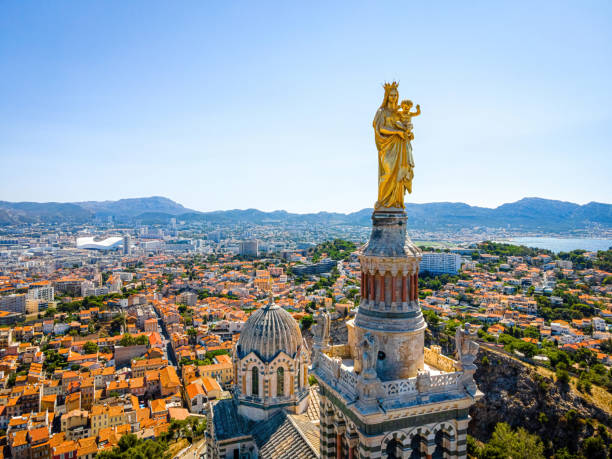 The aerial view of Basilique Notre-Dame-de-la-Garde in Marseille, a port city in France The aerial view of Basilique Notre-Dame-de-la-Garde in Marseille, a port city in southern France old port photos stock pictures, royalty-free photos & images