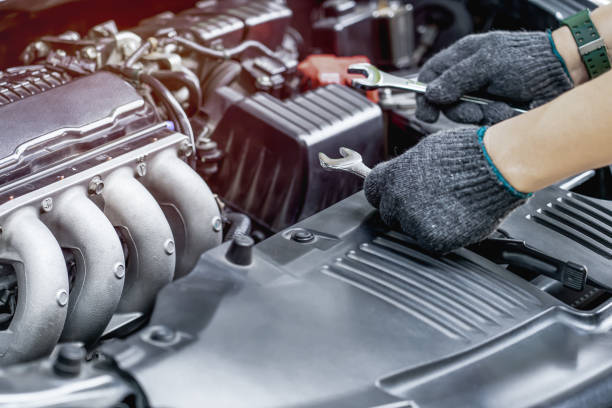 istock Technician is using a wrench for repair car in car service and maintenance concept 1341176070