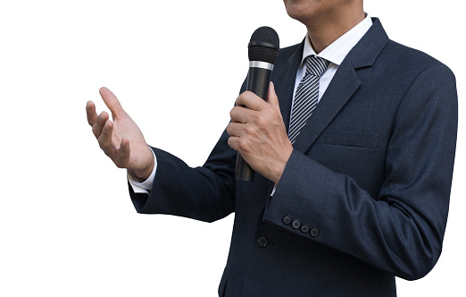 Asian businessman, press man or newsman hand holding wireless microphone conducting a business interview or press conference isolated on white background, close up