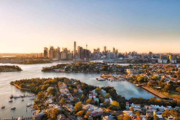D Syd woolwich close CBD Sydney city Inner West suburbs of Balmain in view of CBD high-rise towers and barangaroo - aerial landscape in morning sun light. jetty aerial stock pictures, royalty-free photos & images