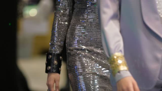 Shiny wristband on model podium defile show. Female vogue fashion runway.