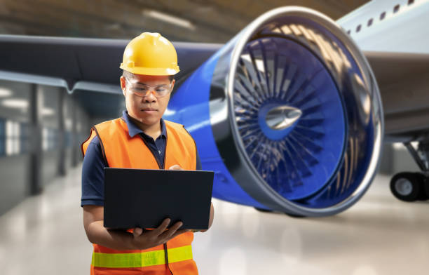 Asian engineer or technician with airplane Asian engineer or technician with airplane in hangar airplane hangar photos stock pictures, royalty-free photos & images