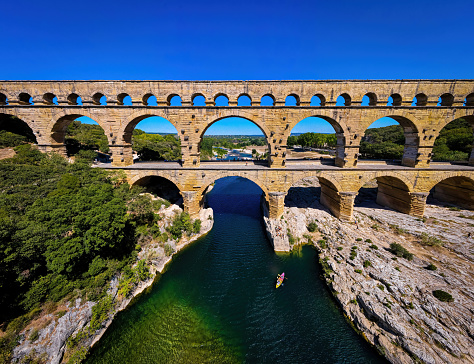 The aerial view of the Pont du Gard, an ancient tri-level Roman aqueduct bridge in Southern France