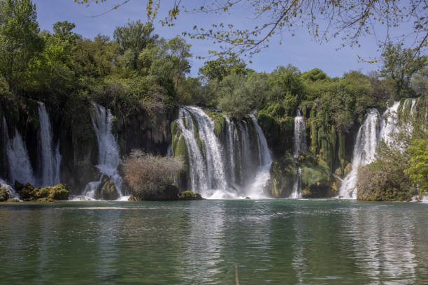 istock Beautiful Kravice waterfall and green river 1341180211