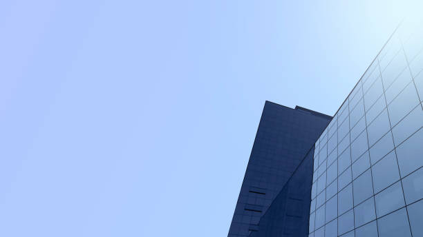 istock mirrored corporate building with blue background for writing. 1341182491