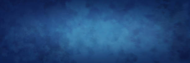 istock blue background with mottled textured vintage grunge and light center with vignette border 1341186905
