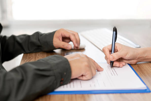 istock Women sign contact  in document  with Insurance agent on clipboard while examining working process Insurance concept 1341187961