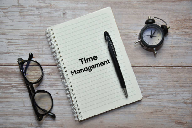 istock TIME MANAGEMENT text on notebook with pen, spectacles and analog alarm clock. Business concept. 1341190174