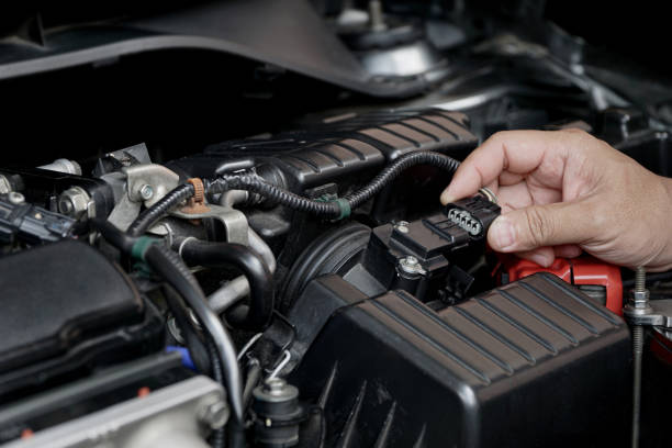 istock Close up Air flow sensor on Air filter of car engine and technician remove plug for checking in service find abnormal 1341190962