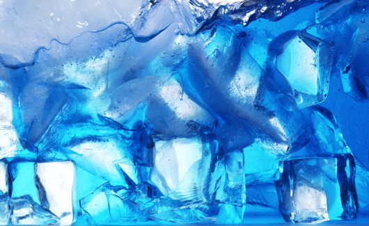 Close-up of ice cubes in a blue light