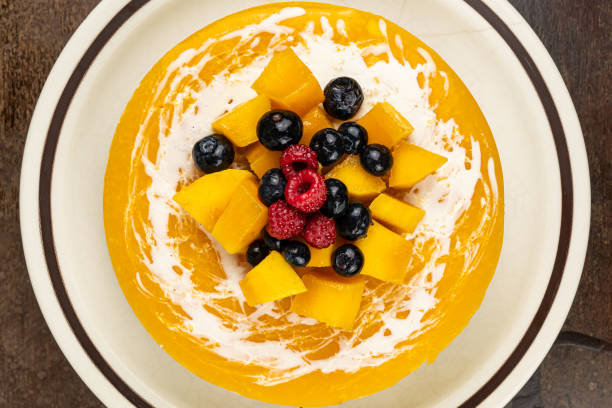 istock Top view of delicious homemade mango cheesecake . 1341198312