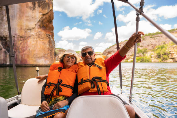 istock Elderly couple enjoying the boat ride 1341199930