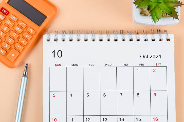 istock October 2021 desk calendar with calculator 1341208202