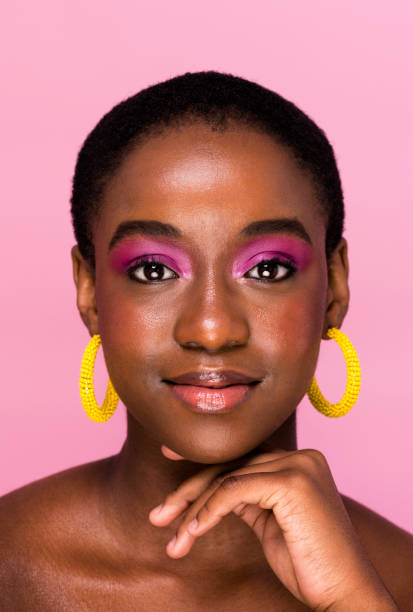 istock Studio portrait young woman with make up hand under chin looking to camera 1341209341
