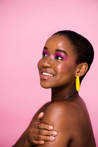 istock Side view young woman bright fun glossy make up looking up 1341209346