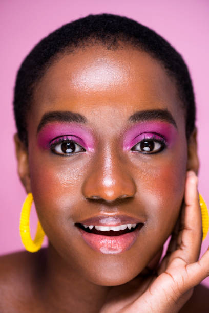 istock Close up beautiful young woman with glossy make up 1341209362