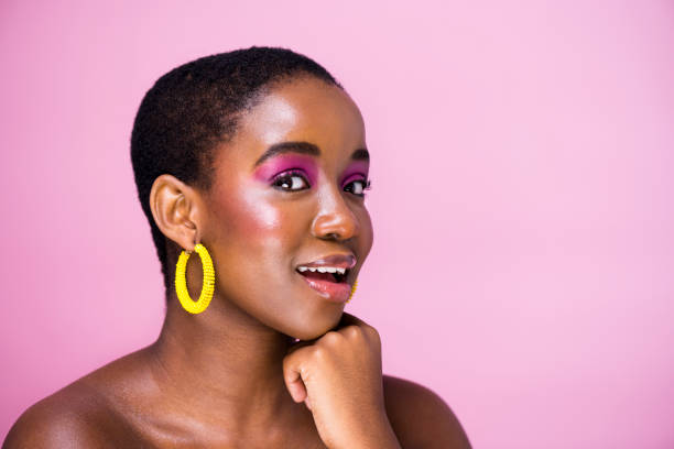 istock Side view African woman with short hair on pink backdrop 1341209411