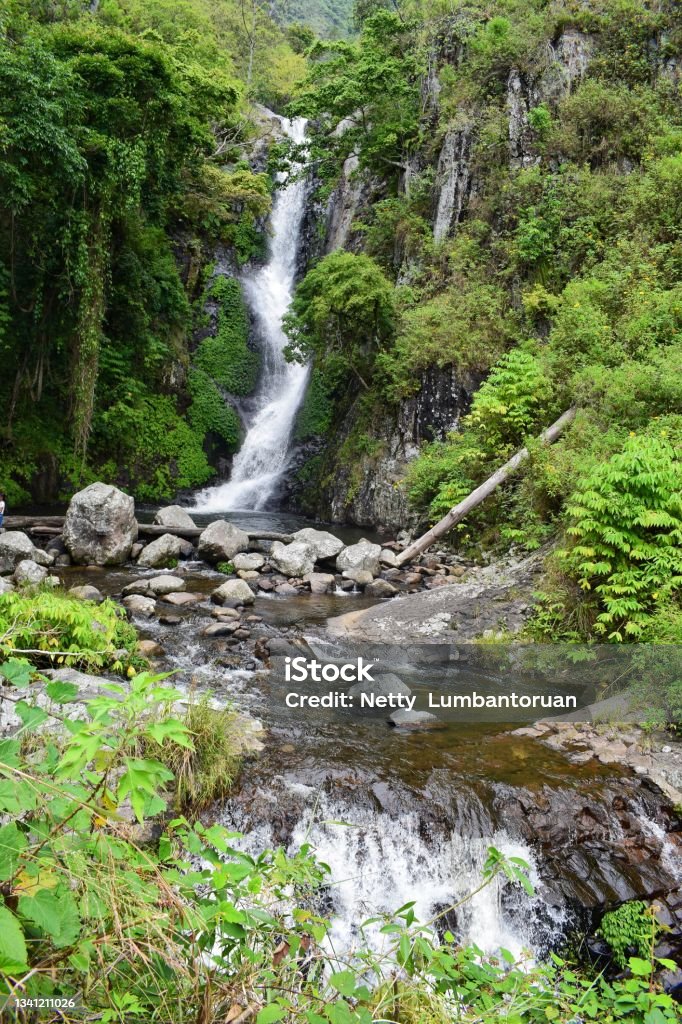 natural tourism Siringo waterfall, Silalahi village, North Sumatra, Indonesia, The beauty of the waterfall with a fresh green background Color Image Stock Photo