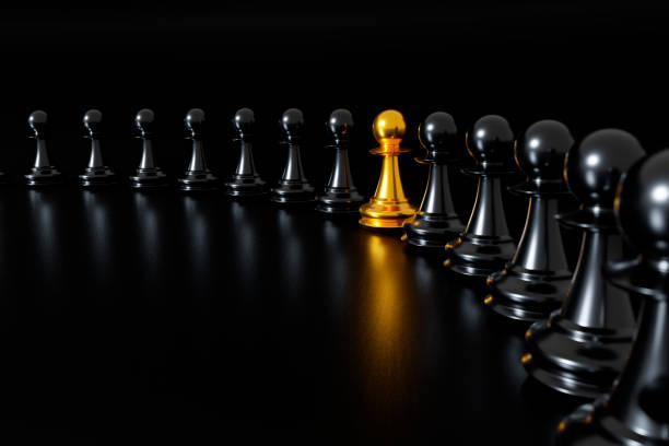 istock Unique gold pawn. Standing out from the crowd concept. 1341211137