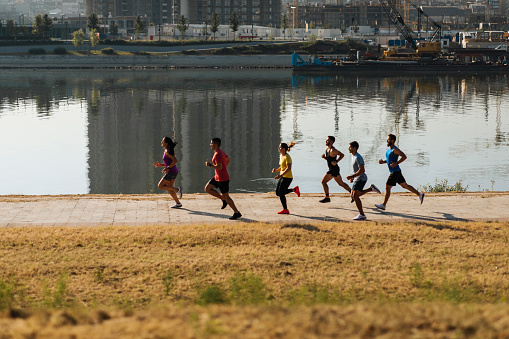 Photo of a group of young runners working out as a group