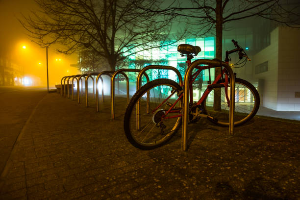 Sheffield cycle stand with single bike at foggy night Guildford Surrey England