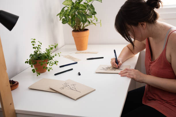 istock woman drawing in her room 1341220532