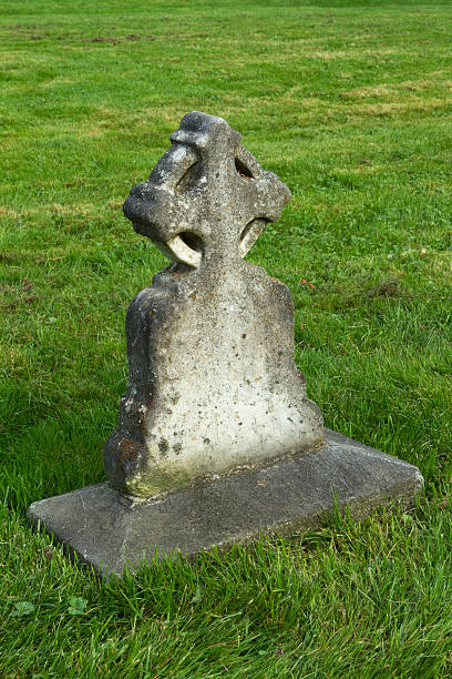 istock Old cross shaped tombstone in a cemetery 134122268
