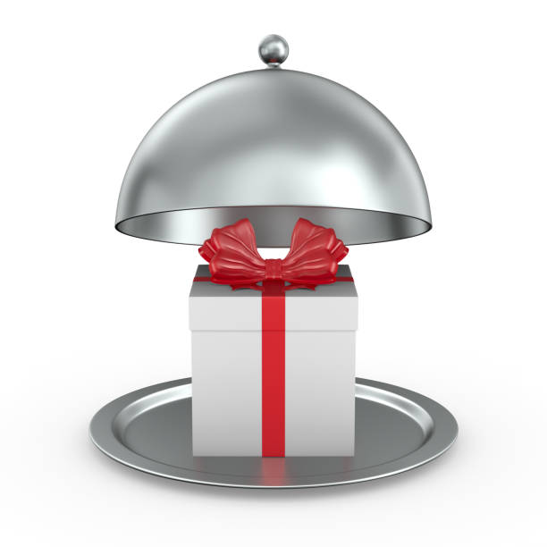 istock open metallic cloche and white gift box with red bow on white background. Isolated 3D illustration 1341224650