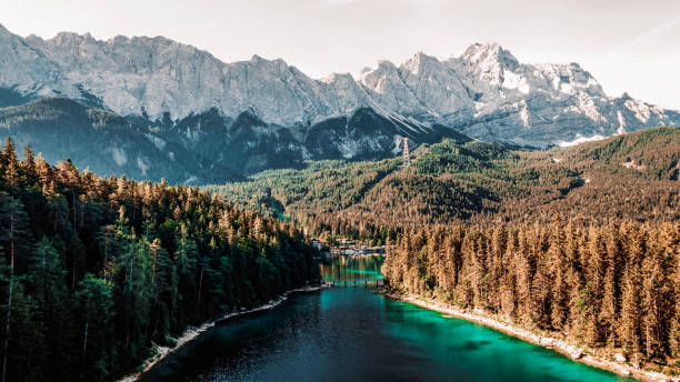 View on Eibsee lake under highest peak in Germany (Zugspitze) Eibsee in Germany with the mountain Zugspitze in the background zugspitze mountain stock pictures, royalty-free photos & images