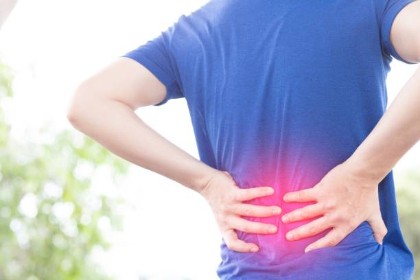istock A man back pain after exercise concept.It happens often in athletes practice overtain,Lifting heavy objects or office syndrome.A Muscle inflammation concept. 1341232284