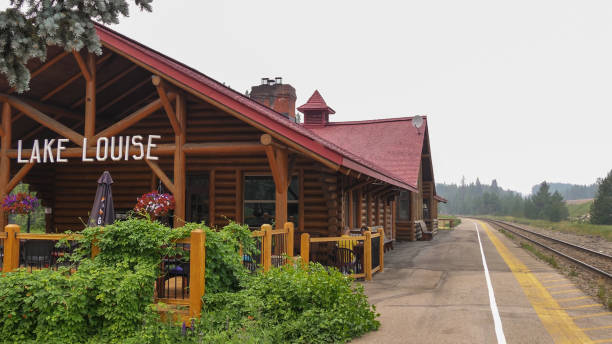 Lake Louise station, Canada - June 09, 2021: Retro board stands by the station platform